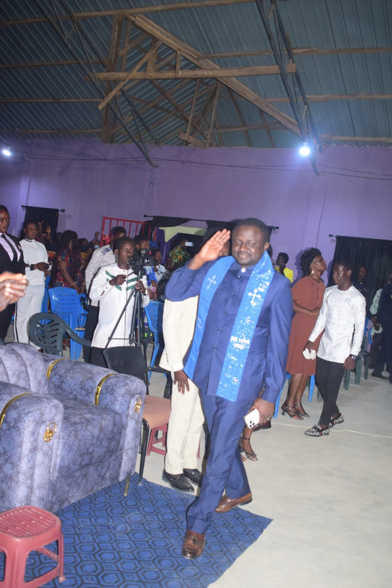 General Overseer greeting the congregation during a service at Christ Rehoboth House Of Grace Church