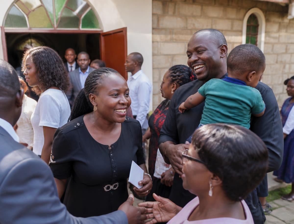 Church members greeting one another after service